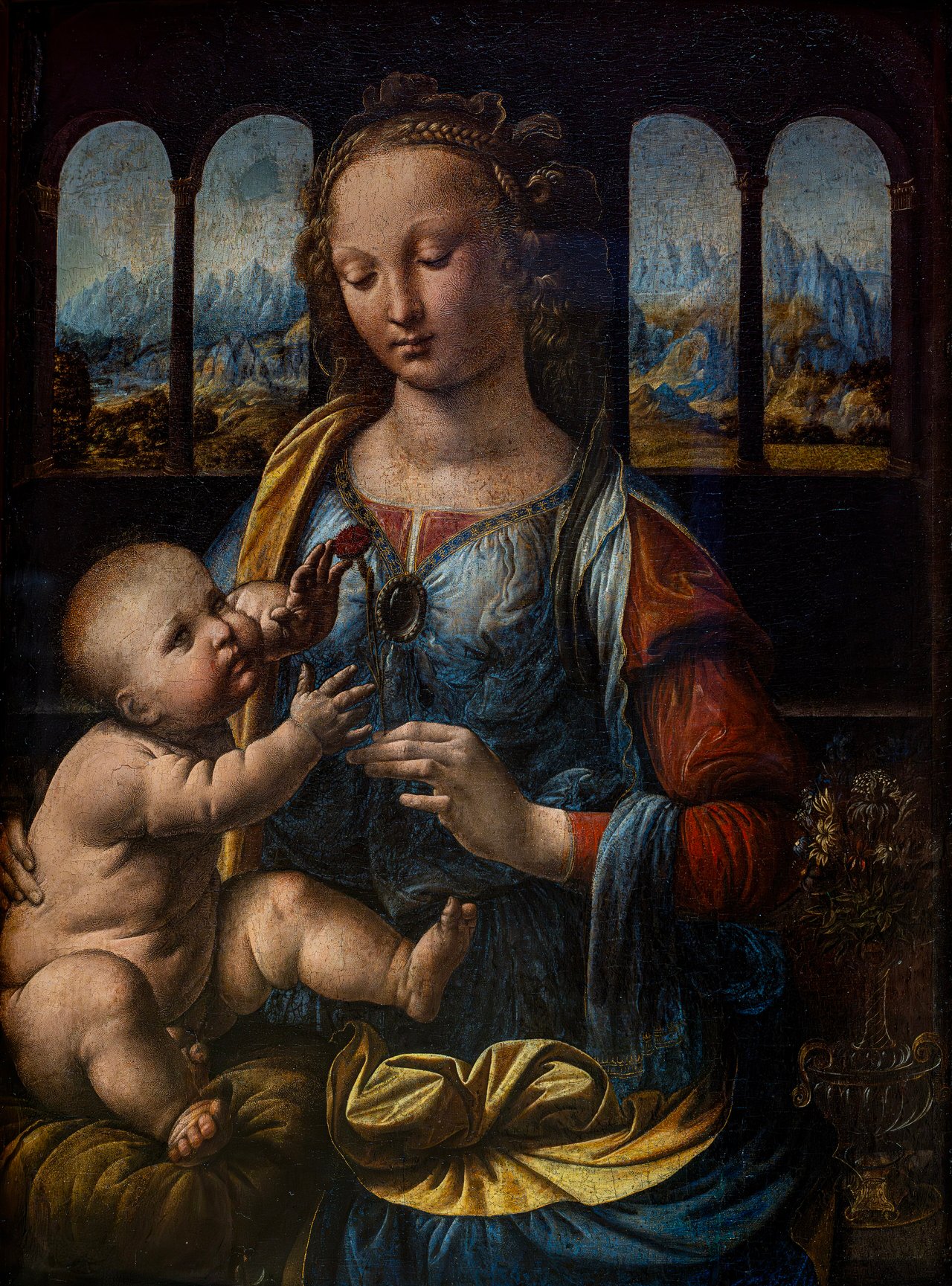 Madona s karafiátem od Leonarda da Vinci, kolem 1478, malý Ježíš uchopil červený karafiát jako symbol umučení
